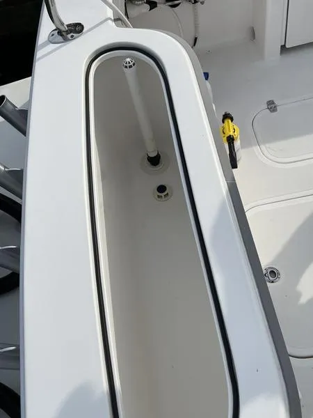 Slide: The Image of 2016 Jarrett Bay 32 Walk Around boat deck with storage compartment. - 22
