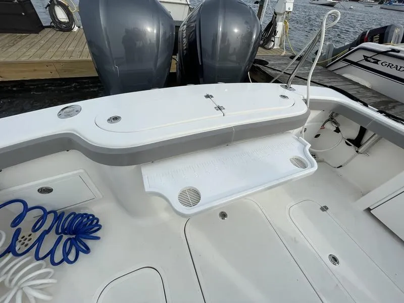 Slide: The Image of 2016 Jarrett Bay 32 Walk Around boat with dual engines at dock. - 4