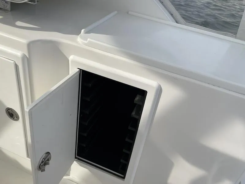 Slide: The Image of Open storage compartment on 2016 Jarrett Bay 32 Walk Around boat. - 40