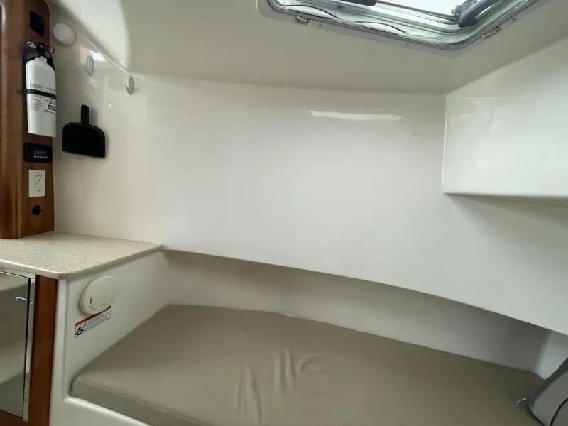 Slide: The Image of Interior cabin of 2016 Jarrett Bay 32 Walk Around boat with cushioned seating. - 43