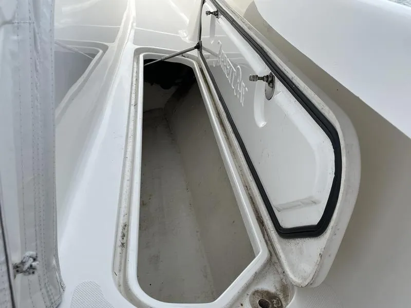 Slide: The Image of Open storage compartment on a 2016 Jarrett Bay 32 Walk Around boat. - 45