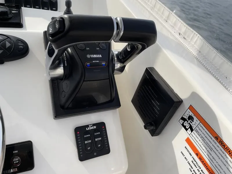 Slide: The Image of Control panel of 2016 Jarrett Bay 32 Walk Around boat with Yamaha throttle. - 7