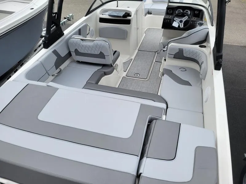 Slide: The Image of 2025 Bayliner VR6 OB boat interior with spacious seating and modern design. - 10