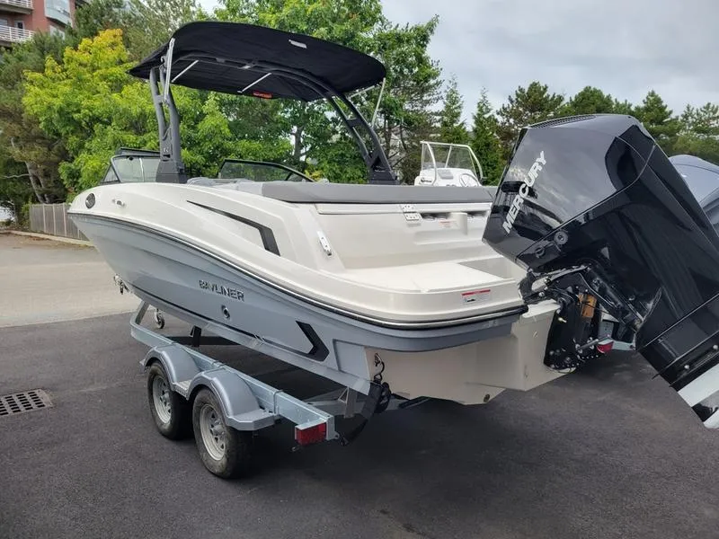 Slide: The Image of 2025 Bayliner VR6 OB boat on trailer, featuring sleek design and powerful outboard motor. - 11