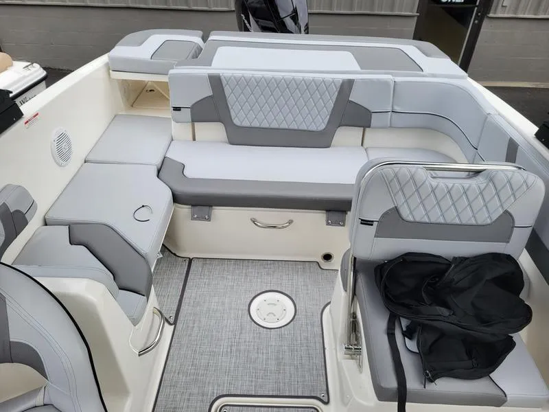Slide: The Image of 2025 Bayliner VR6 OB boat interior with gray seating and modern design. - 12