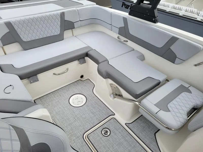 Slide: The Image of 2025 Bayliner VR6 OB boat interior with gray seating and modern design. - 15