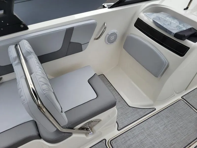 Slide: The Image of 2025 Bayliner VR6 OB boat interior with gray seating and modern design. - 8