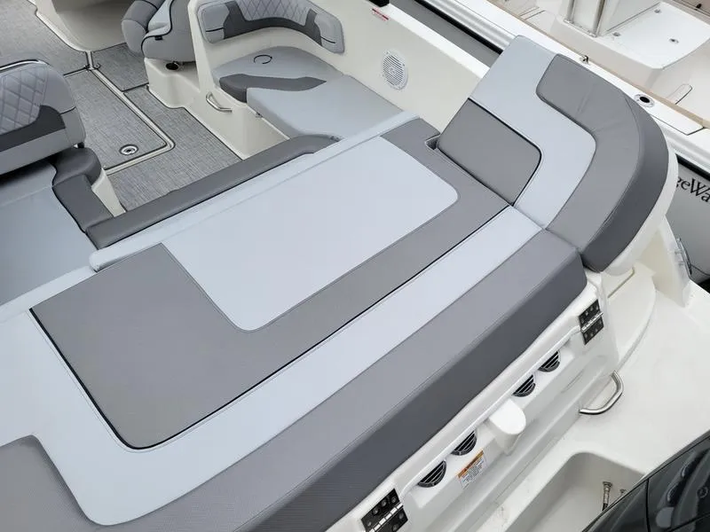 Slide: The Image of 2025 Bayliner VR6 OB boat interior with gray seating and modern design. - 9