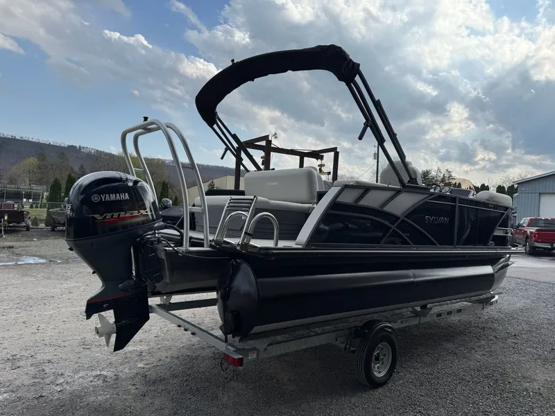 Slide: The Image of 2025 Sylvan 8520 CLZ DH pontoon boat with Yamaha motor on trailer. - 11