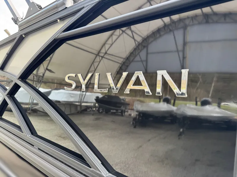 Slide: The Image of Sylvan 8520 CLZ DH 2025 boat in storage facility. - 13