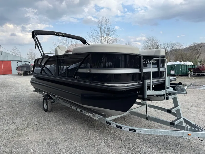Slide: The Image of 2025 Sylvan 8520 CLZ DH pontoon boat on trailer, cloudy sky. - 3