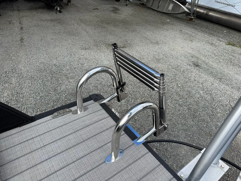 Slide: The Image of Sylvan 8520 CLZ DH 2025 boat deck with stainless steel ladder. - 33