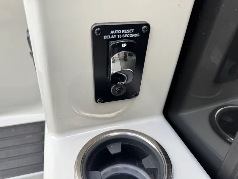 Slide: The Image of Sylvan 8520 CLZ DH 2025 boat control with auto-reset switch. - 9