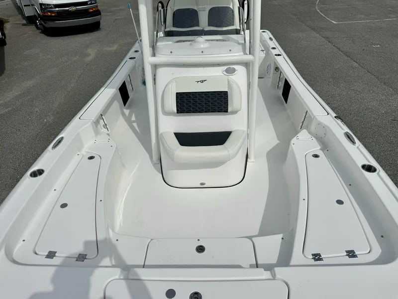 Slide: The Image of 2025 Tidewater 2210 Carolina Bay boat interior with seating and storage compartments. - 11