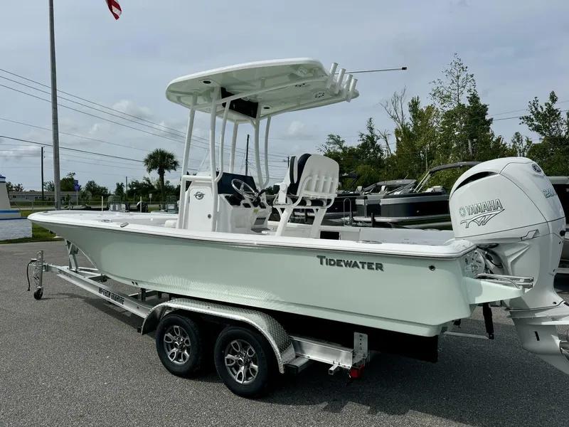 Slide: The Image of 2025 Tidewater 2210 Carolina Bay boat on trailer, featuring Yamaha engine. - 3
