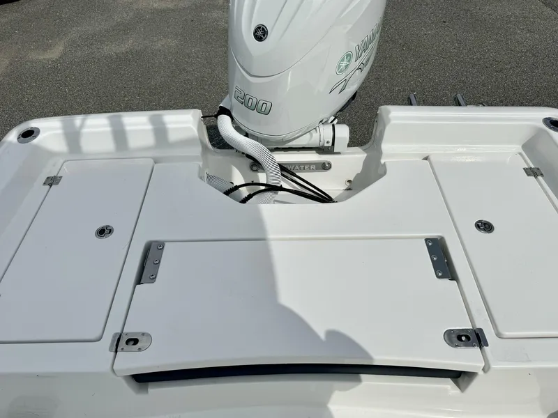 Slide: The Image of 2025 Tidewater 2210 Carolina Bay boat with Yamaha 200 engine, rear deck view. - 8