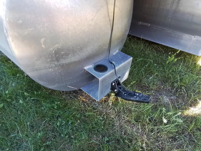 Slide: The Image of Close-up of 2021 Bennington Marine 24 LXSR pontoon detail on grass. - 15