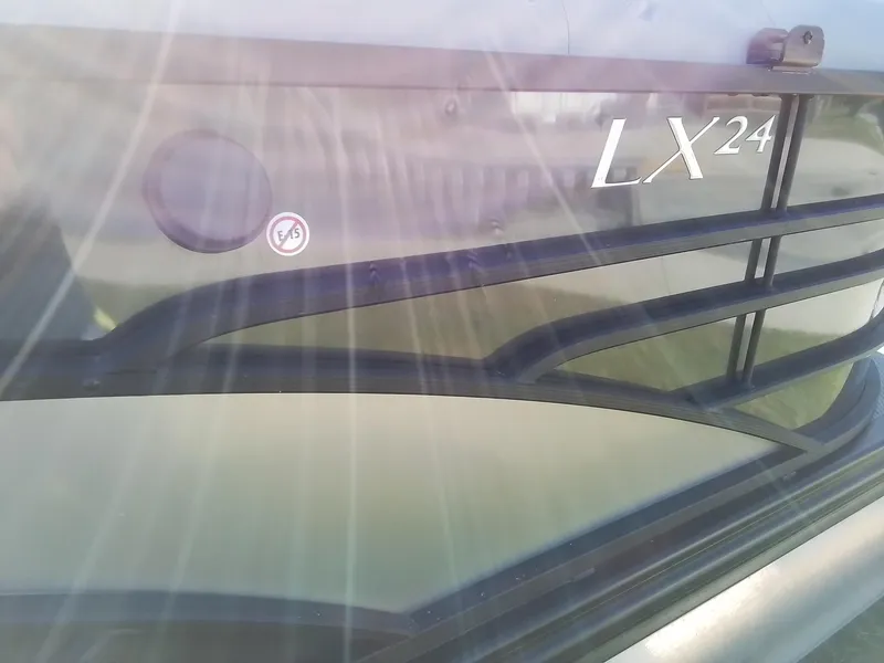 Slide: The Image of 2021 Bennington Marine 24 LXSR boat detail with sunlight reflections. - 18