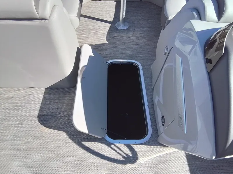 Slide: The Image of 2021 Bennington Marine 24 LXSR boat interior with open storage compartment. - 30