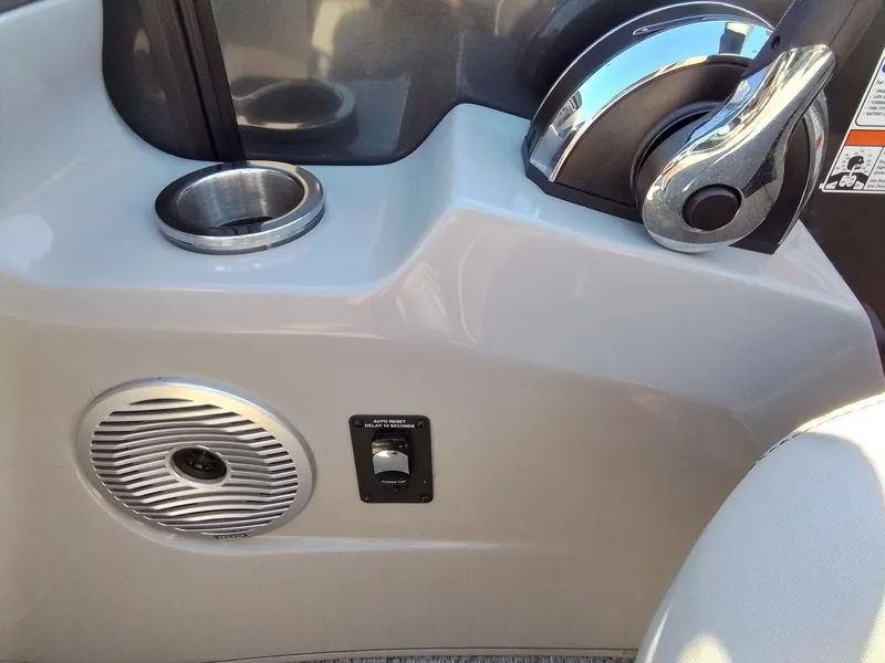 Slide: The Image of 2021 Bennington Marine 24 LXSR boat console with throttle, cup holder, and speaker. - 36