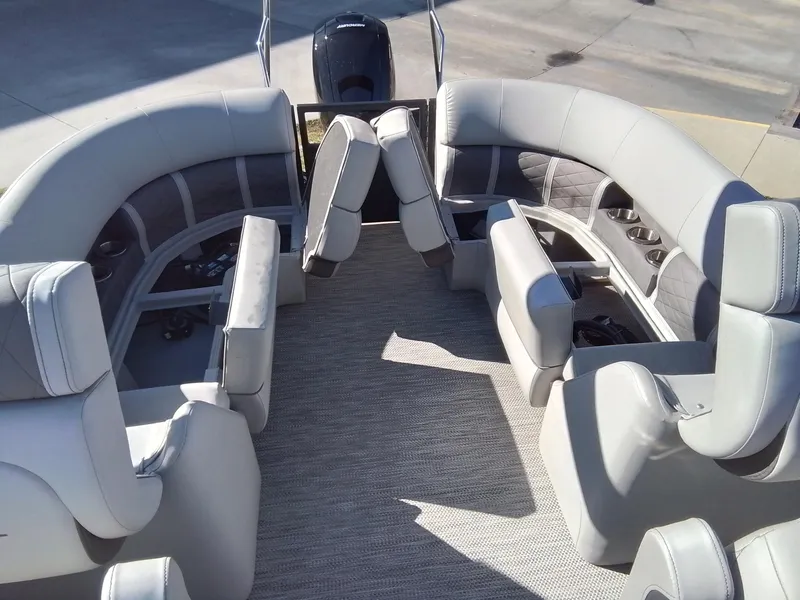 Slide: The Image of 2021 Bennington Marine 24 LXSR pontoon boat interior with gray seating and carpet. - 40