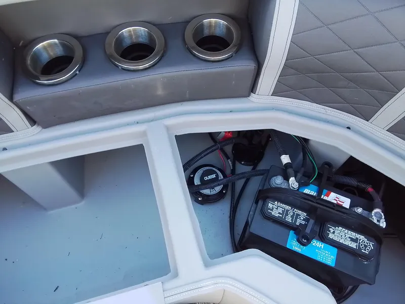 Slide: The Image of 2021 Bennington Marine 24 LXSR boat battery compartment with cup holders. - 41