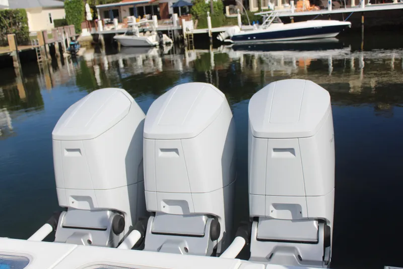 Slide: The Image of Three outboard engines of HCB 42 Lujo 2023 by the water. - 15