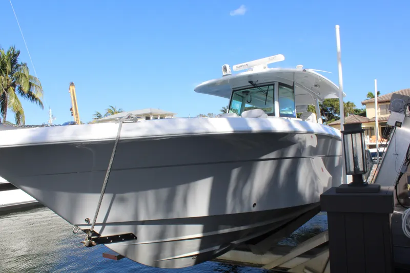 Slide: The Image of HCB 42 Lujo 2023 boat docked under sunny skies. - 27