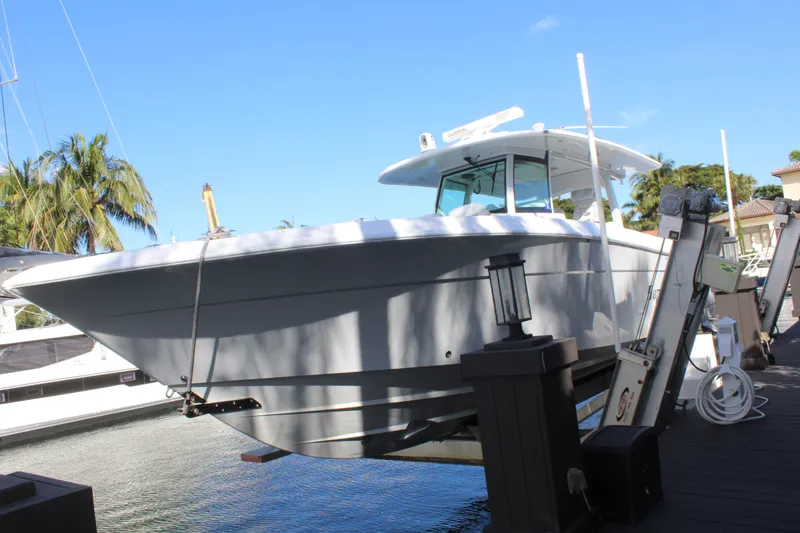 Slide: The Image of 2023 HCB 42 Lujo boat docked by waterfront. - 29