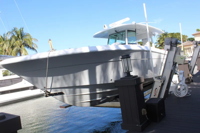 Slide: The Image of HCB 42 Lujo 2023 boat at dock, sunny day. - 30