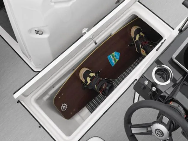 Slide: The Image of Yamaha AR250 boat storage compartment with wakeboard, 2025 model. - 4