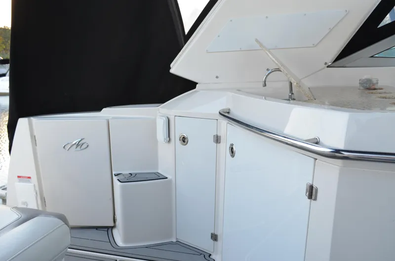 Slide: The Image of 2009 Monterey 320 Sport Yacht interior with sink and storage cabinets. - 11