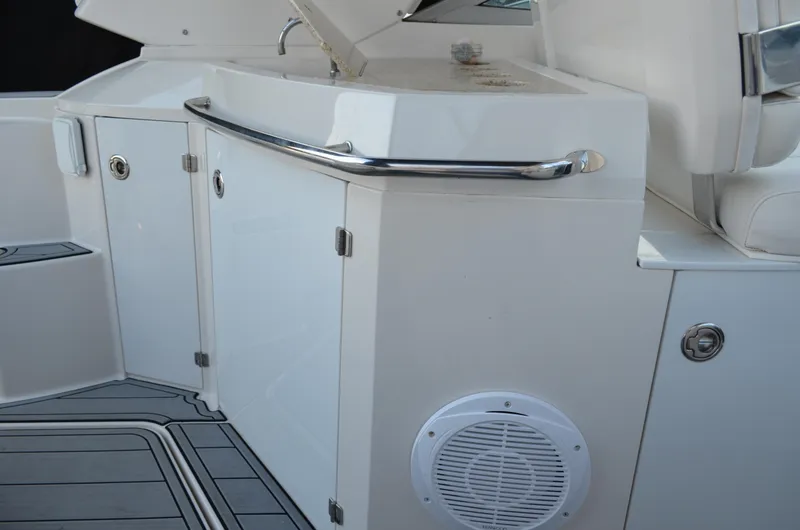 Slide: The Image of 2009 Monterey 320 Sport Yacht interior with sleek cabinetry and speaker. - 12