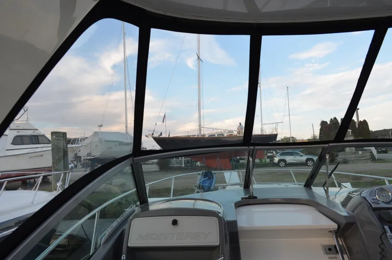 Slide: The Image of 2009 Monterey 320 Sport Yacht interior view with marina background. - 15