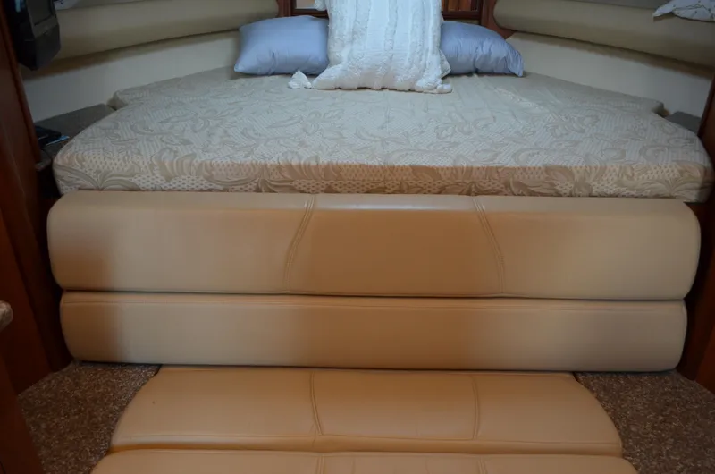 Slide: The Image of Interior cabin of 2009 Monterey 320 Sport Yacht with cushioned seating and bed. - 29