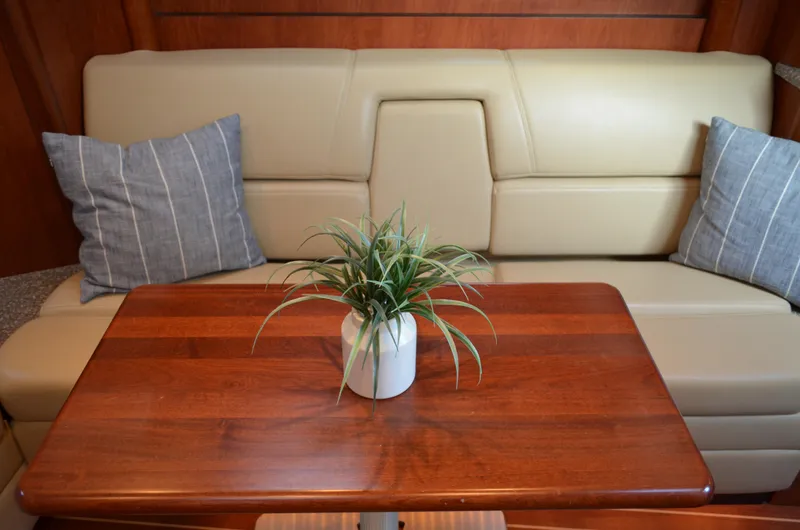Slide: The Image of Luxurious 2009 Monterey 320 Sport Yacht interior with leather seating and wooden table. - 30