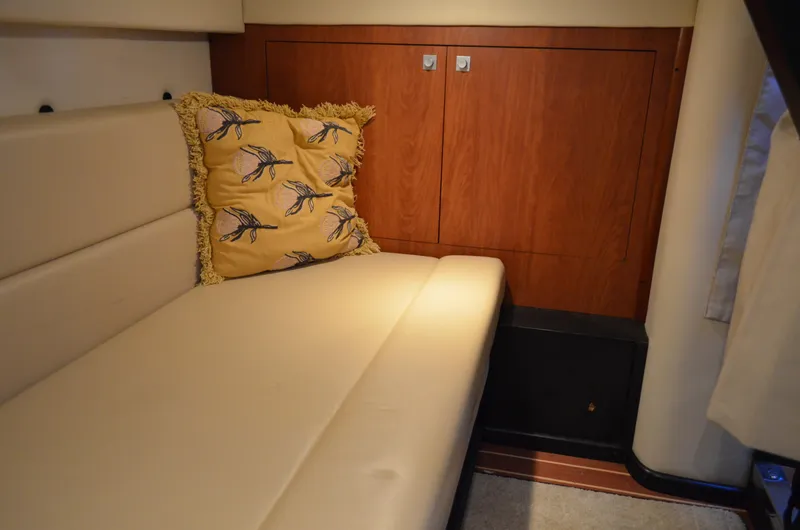 Slide: The Image of Interior of 2009 Monterey 320 Sport Yacht with beige seating and decorative pillow. - 39