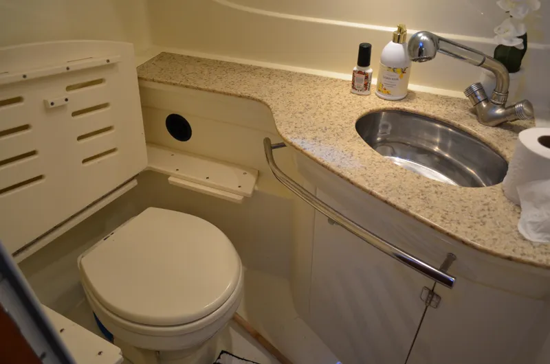 Slide: The Image of 2009 Monterey 320 Sport Yacht bathroom with sink, toilet, and granite countertop. - 41