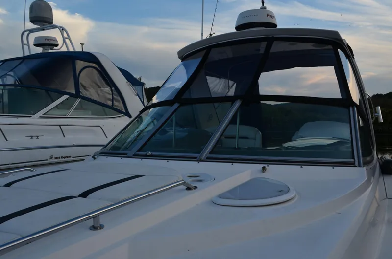 Slide: The Image of 2009 Monterey 320 Sport Yacht docked with sleek design and modern features. - 5