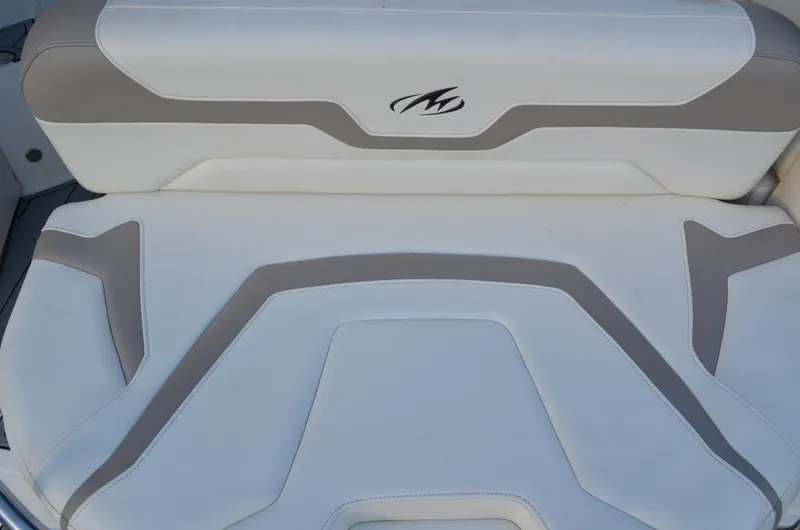 Slide: The Image of White and gray seating on 2009 Monterey 320 Sport Yacht, featuring stylish design and logo. - 7