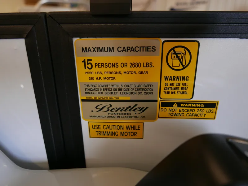 Slide: The Image of Capacity warning label on 2025 Bentley Pontoons Legacy 223 Navigator boat. - 11