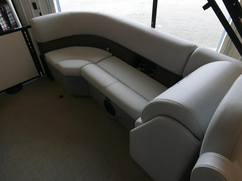Slide: The Image of 2025 Bentley Pontoons Legacy 223 Navigator interior seating, featuring luxurious gray upholstery. - 13