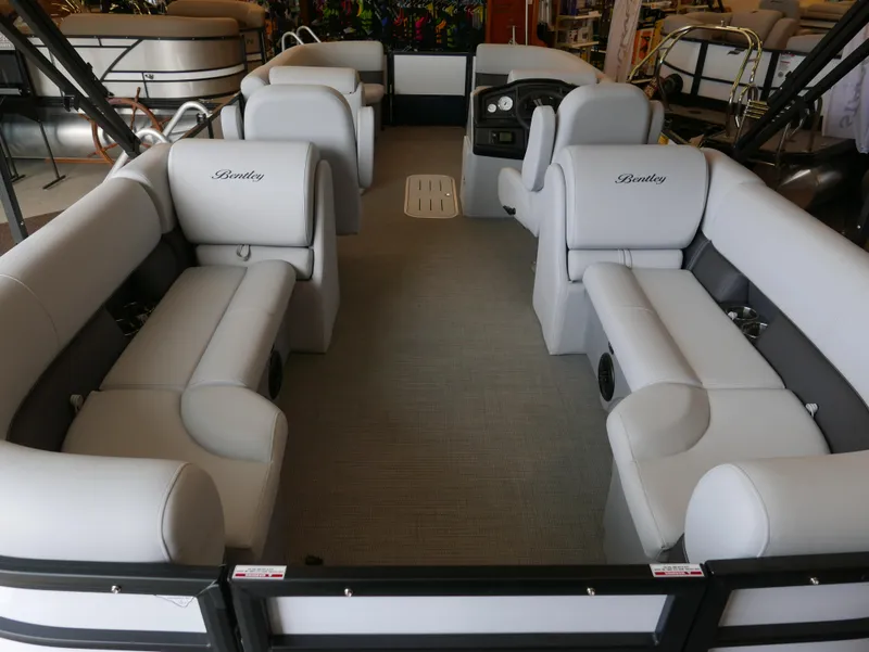 Slide: The Image of 2025 Bentley Pontoons Legacy 223 Navigator interior with spacious seating and modern design. - 2