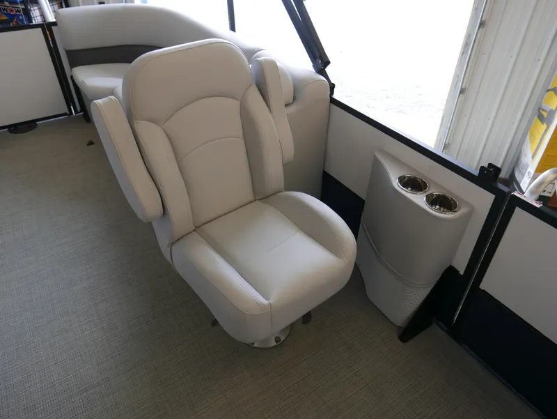 Slide: The Image of 2025 Bentley Pontoons Legacy 223 Navigator interior with plush seating and cup holders. - 7
