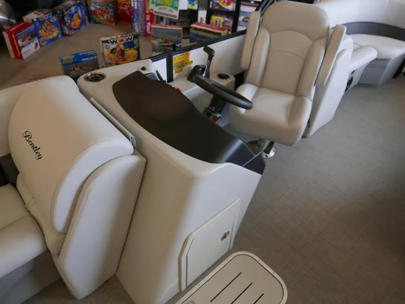 Slide: The Image of Interior of 2025 Bentley Pontoons Legacy 223 Navigator, featuring luxurious seating and helm. - 8