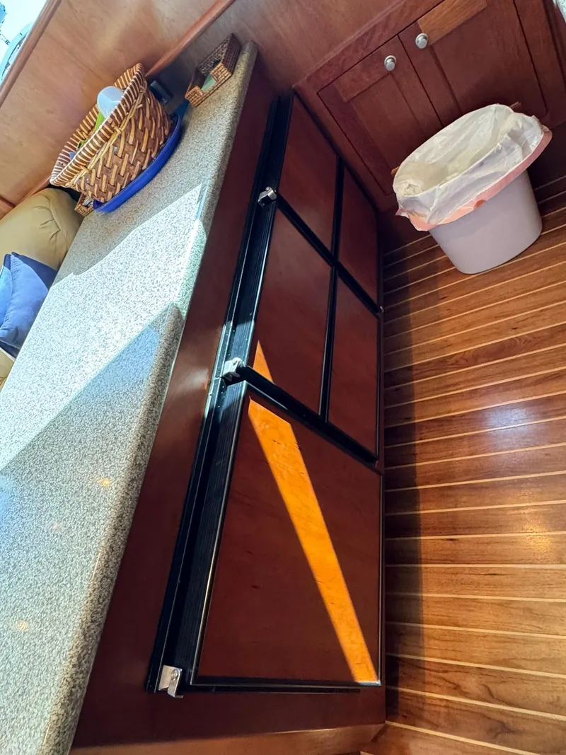 Slide: The Image of 2003 Rampage 45 Convertible interior with wooden cabinets and countertop. - 13