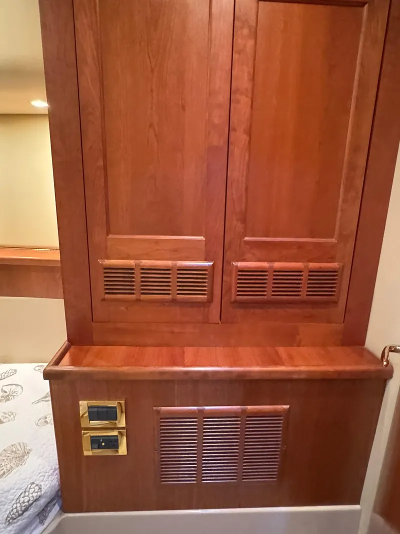 Slide: The Image of 2003 Rampage 45 Convertible interior with wooden cabinetry and ventilation panels. - 20