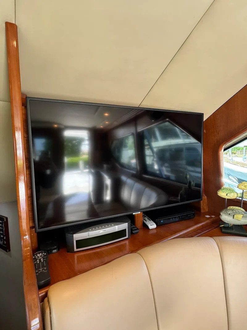 Slide: The Image of Interior of 2003 Rampage 45 Convertible yacht with mounted TV and entertainment system. - 28