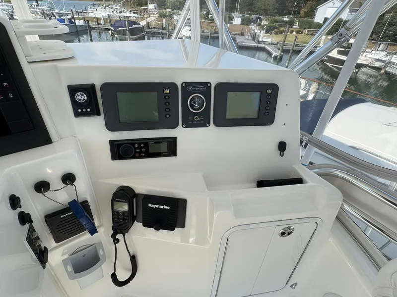 Slide: The Image of Control panel of a 2003 Rampage 45 Convertible boat with navigation equipment. - 38