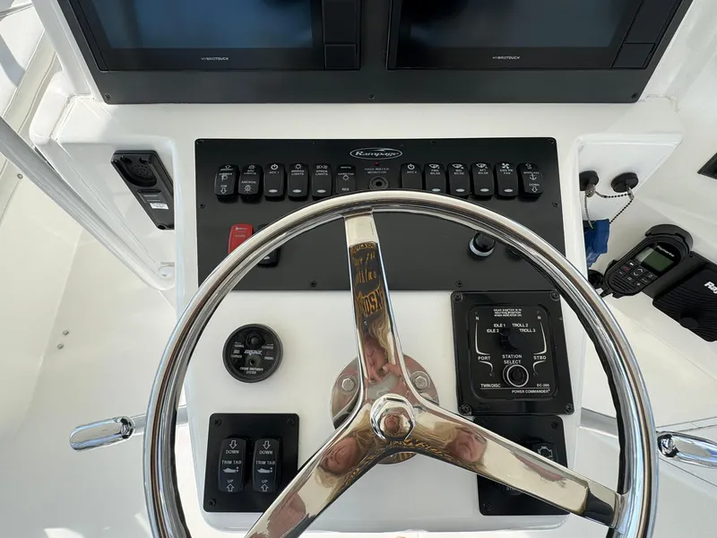 Slide: The Image of Control panel of 2003 Rampage 45 Convertible boat with steering wheel and electronic displays. - 39